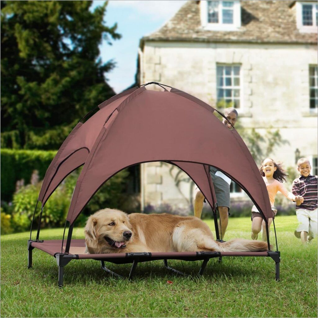 Dog laying on an Elevated Dog Bed with Shade Tent in a backyard